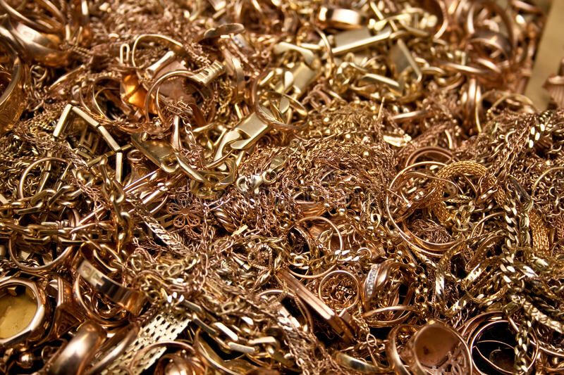 A messy pile of gold chains and rings.